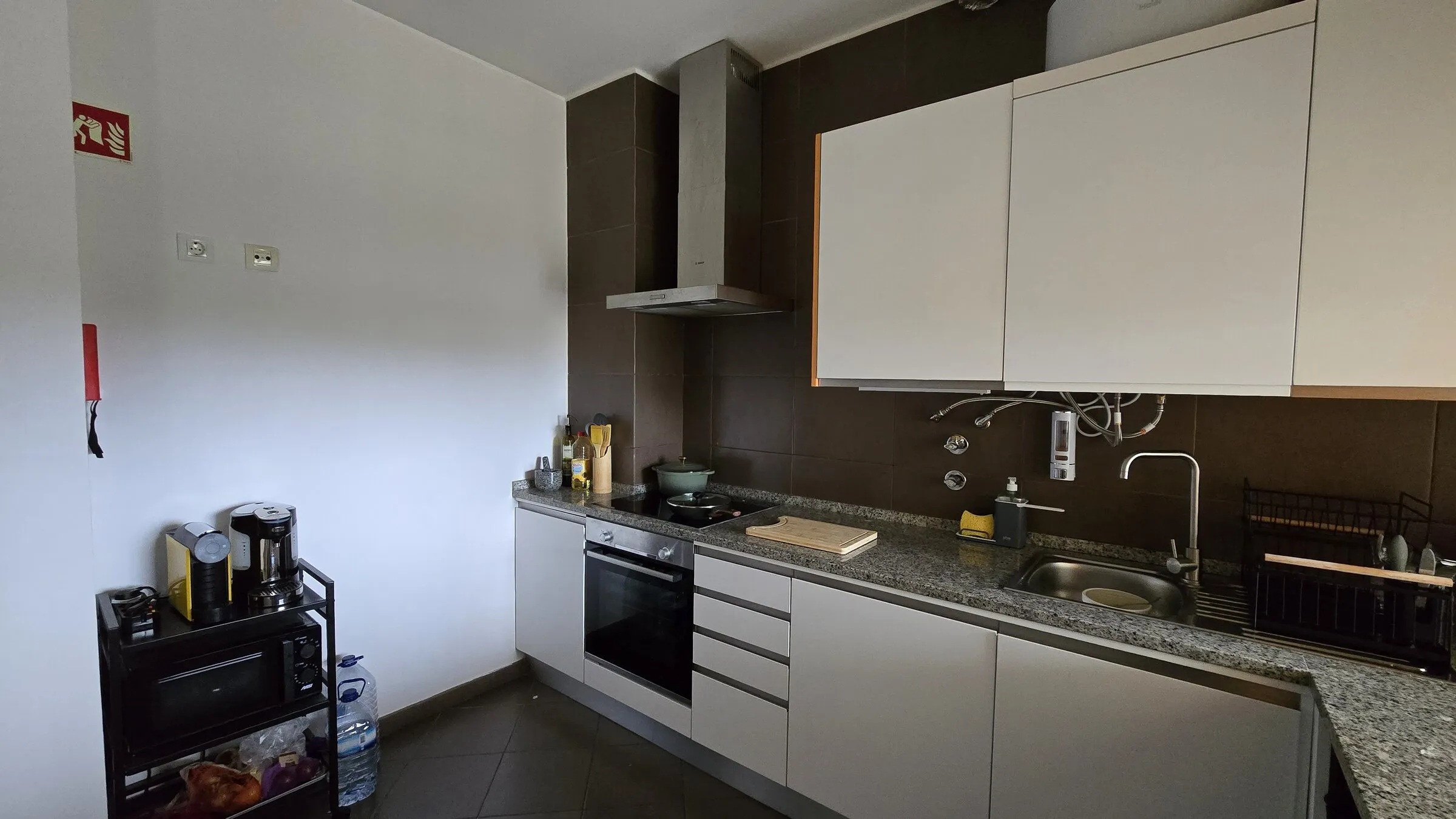 Fully equipped modern kitchen with espresso machine